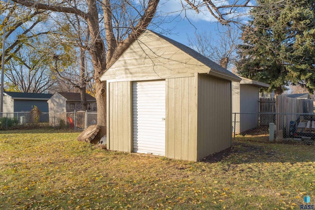 view of outdoor structure with a lawn