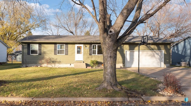 view of front of property featuring a garage and a front lawn