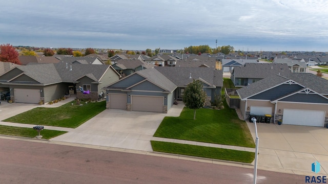 view of front of house featuring a garage and a front yard