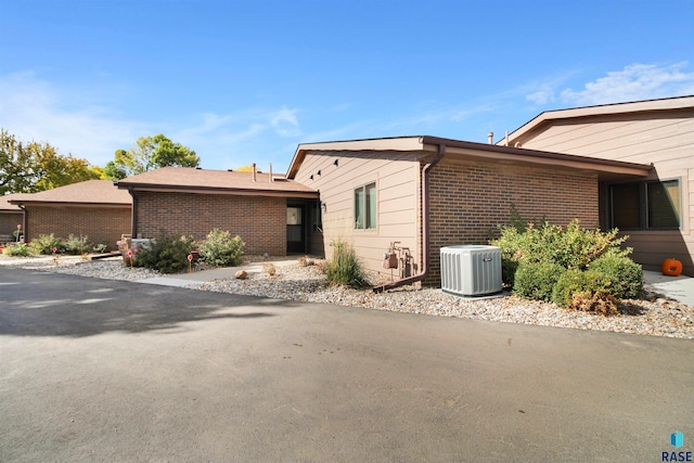 view of home's exterior featuring central AC