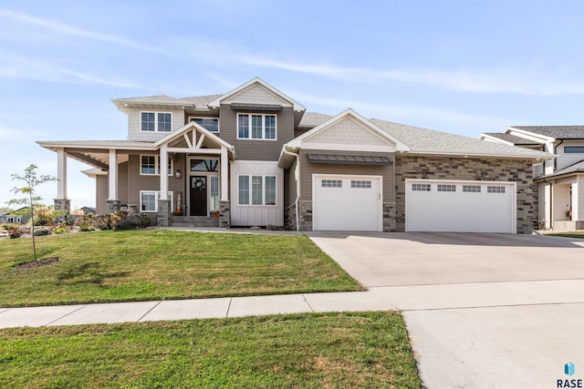 craftsman-style house featuring a front yard and a garage