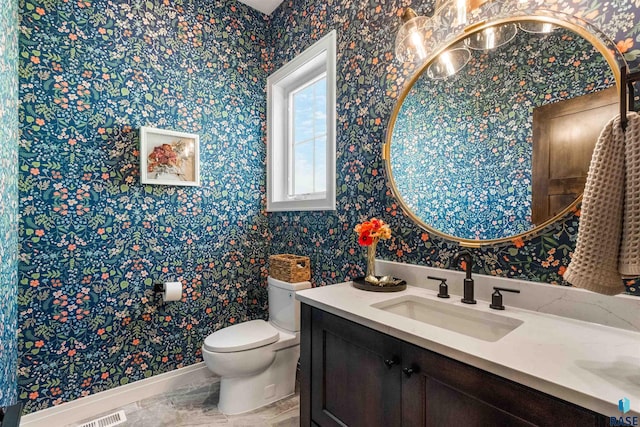 bathroom with vanity and toilet