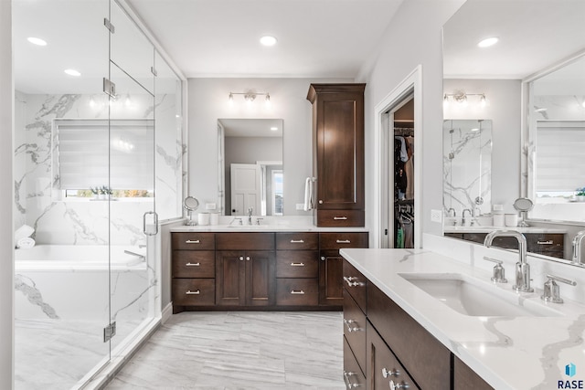 bathroom with vanity and plus walk in shower