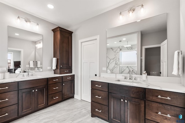 bathroom featuring vanity and walk in shower