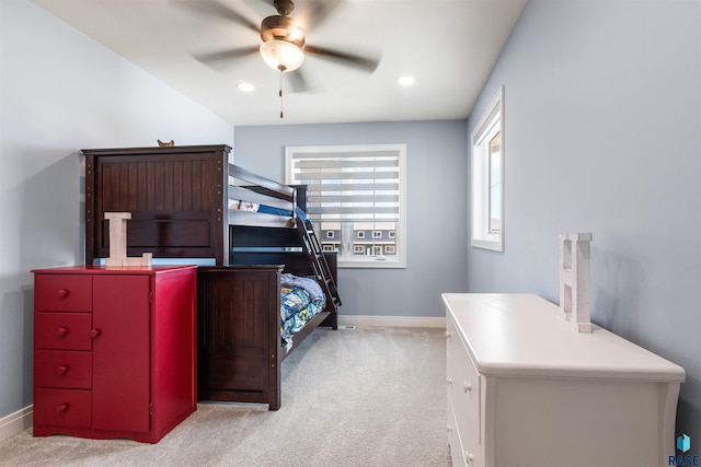 bedroom with light colored carpet and ceiling fan