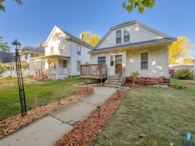 view of front of house featuring a porch and a front lawn