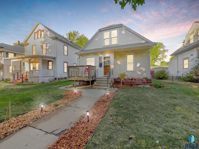 view of front of house featuring a yard and a porch