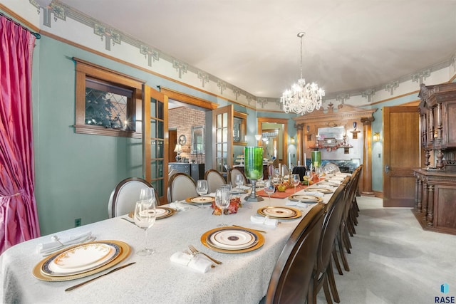 carpeted dining area featuring a chandelier