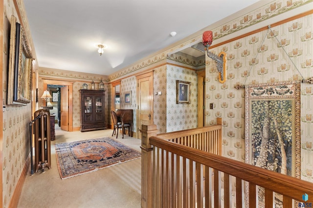 corridor with light carpet and ornamental molding