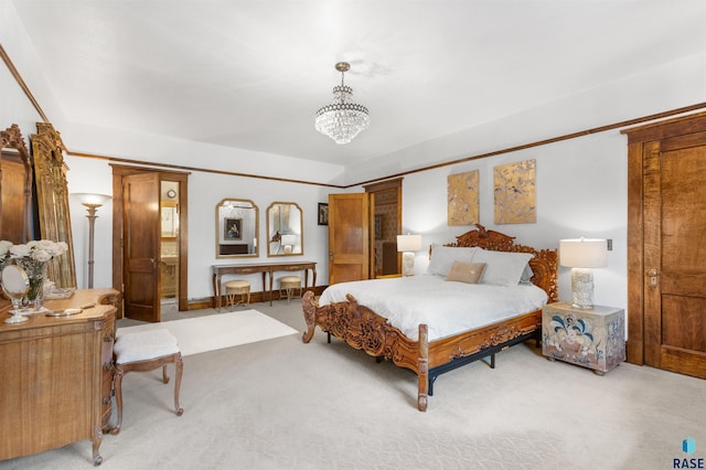 carpeted bedroom with a notable chandelier