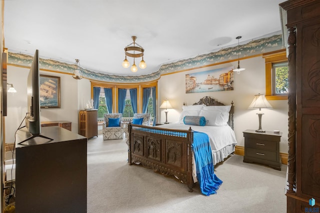 bedroom with a notable chandelier, light carpet, and multiple windows