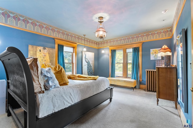 bedroom with multiple windows, light colored carpet, and radiator