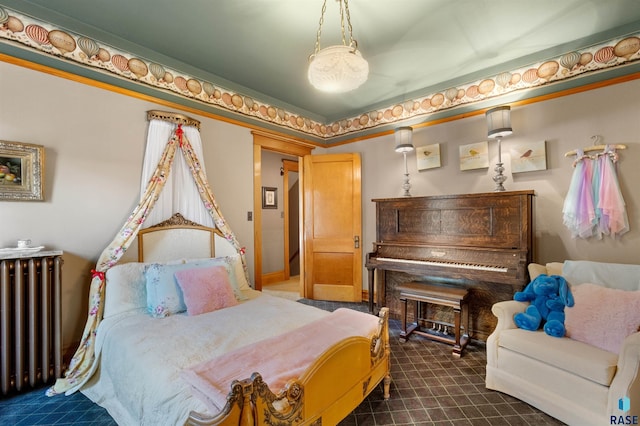 carpeted bedroom featuring radiator