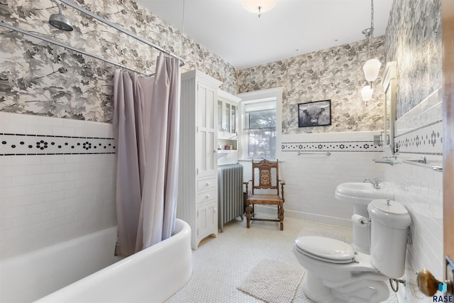 bathroom featuring radiator, toilet, shower / bath combo with shower curtain, tile walls, and tile patterned flooring