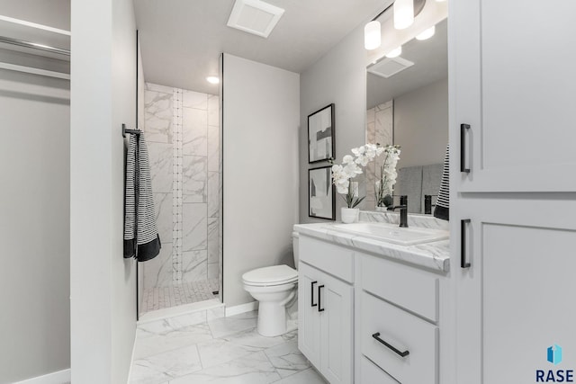 bathroom with vanity, toilet, and an enclosed shower