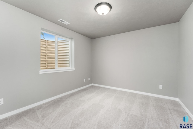 unfurnished room featuring carpet flooring