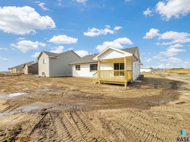 back of property featuring a wooden deck and central air condition unit