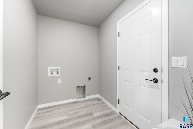 clothes washing area with light hardwood / wood-style floors, electric dryer hookup, and washer hookup