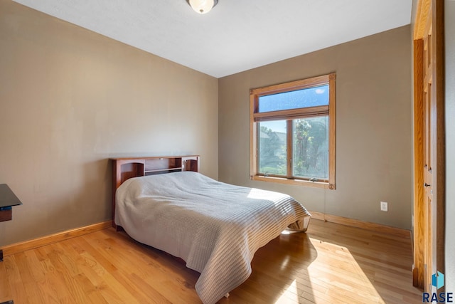 bedroom with light hardwood / wood-style flooring