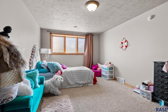 carpeted bedroom featuring a textured ceiling