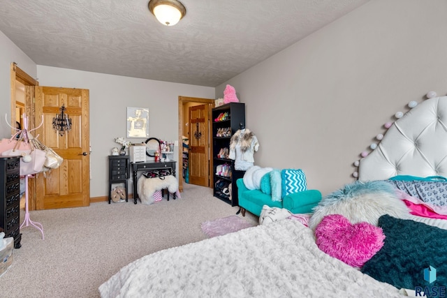 carpeted bedroom featuring a textured ceiling