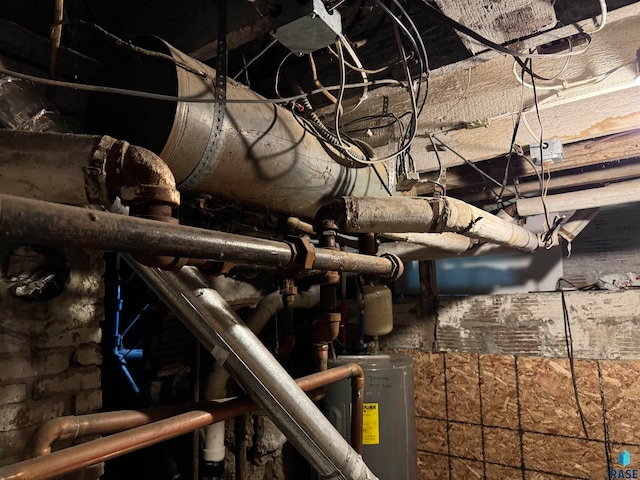 utility room featuring water heater