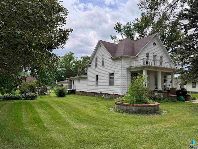 view of property exterior with a yard