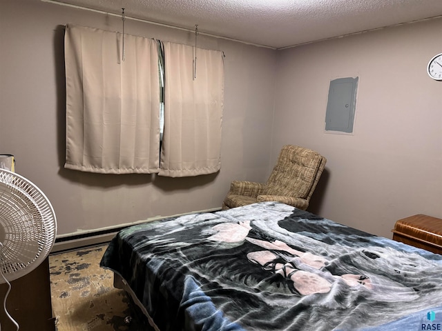 bedroom featuring a textured ceiling and electric panel