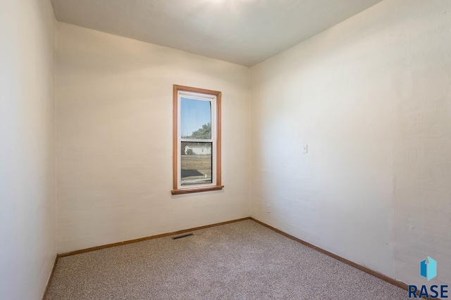 empty room featuring carpet floors