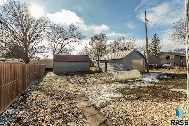 view of yard featuring an outbuilding and a garage