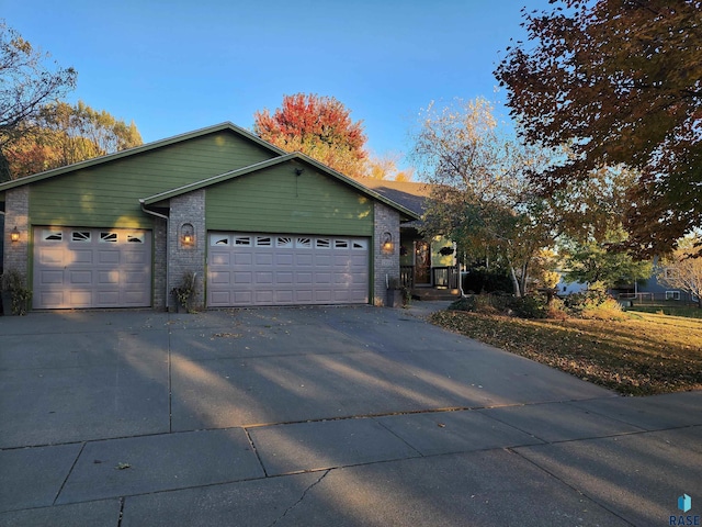 ranch-style home featuring a garage