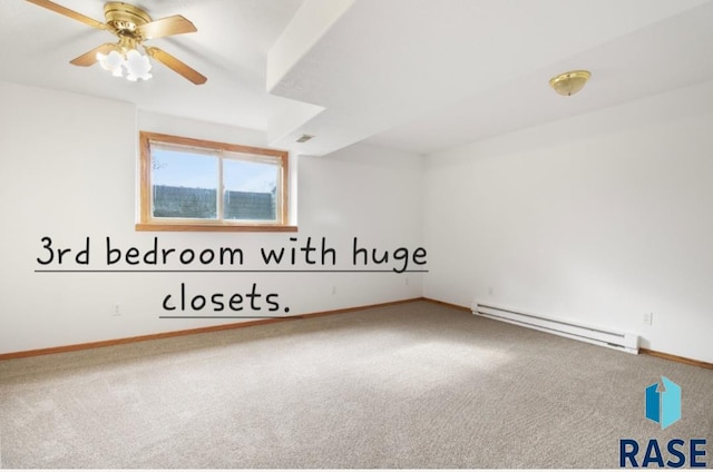 carpeted empty room featuring baseboard heating and ceiling fan