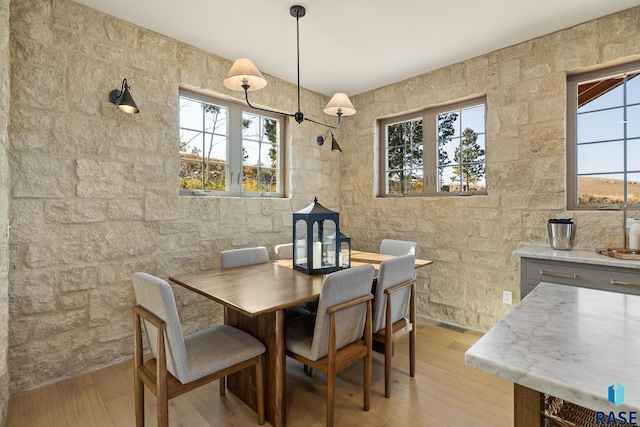 dining room featuring light hardwood / wood-style flooring