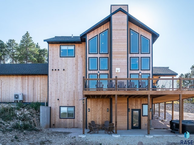 back of property with a patio and a deck