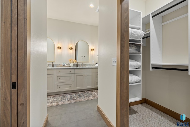 bathroom with vanity and tile patterned floors