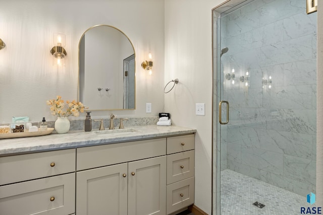 bathroom with vanity and a shower with shower door