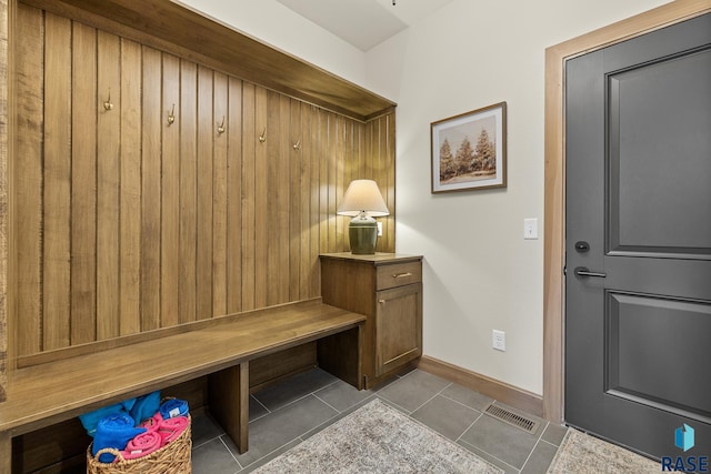 mudroom with light tile patterned floors