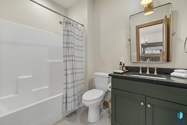 full bathroom featuring vanity, shower / bath combo with shower curtain, toilet, and tile patterned flooring