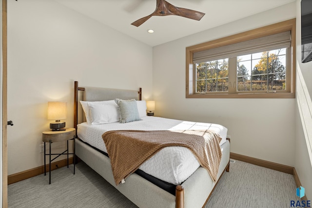 carpeted bedroom featuring ceiling fan