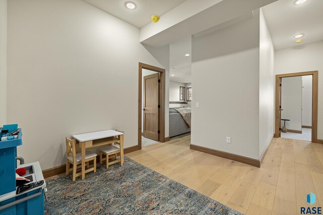 corridor featuring light hardwood / wood-style floors