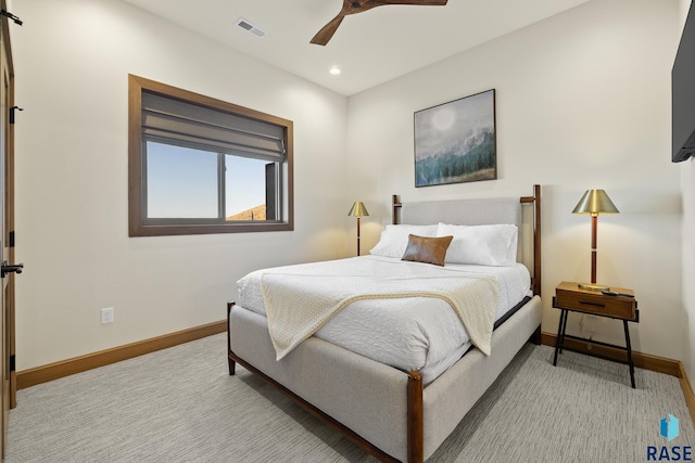 bedroom with light colored carpet and ceiling fan