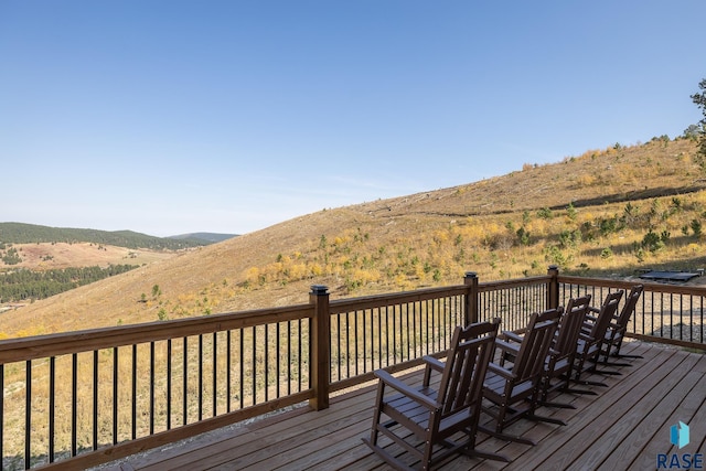 wooden terrace with a mountain view