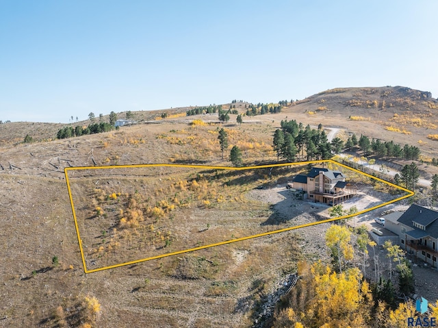 birds eye view of property with a rural view