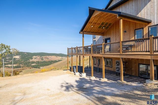 exterior space featuring a deck with mountain view