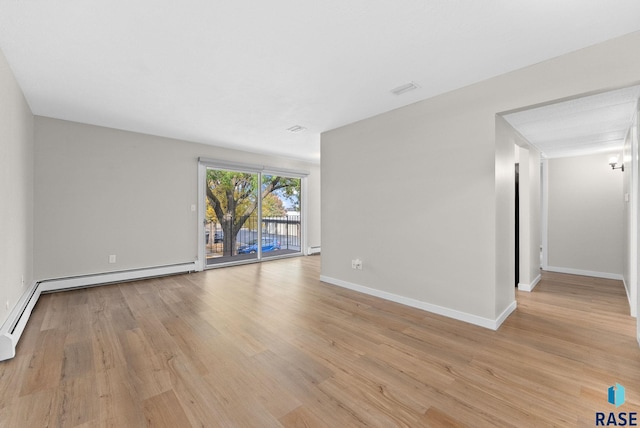 spare room with light wood-type flooring