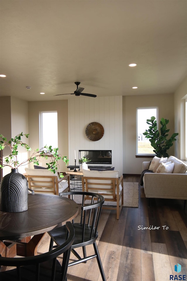 dining area featuring wood-type flooring and ceiling fan