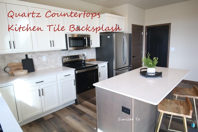 kitchen with a center island, tasteful backsplash, white cabinets, stainless steel appliances, and dark hardwood / wood-style floors