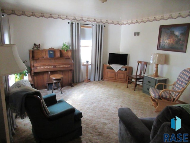 carpeted living room featuring a healthy amount of sunlight