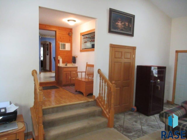 stairway featuring wood-type flooring