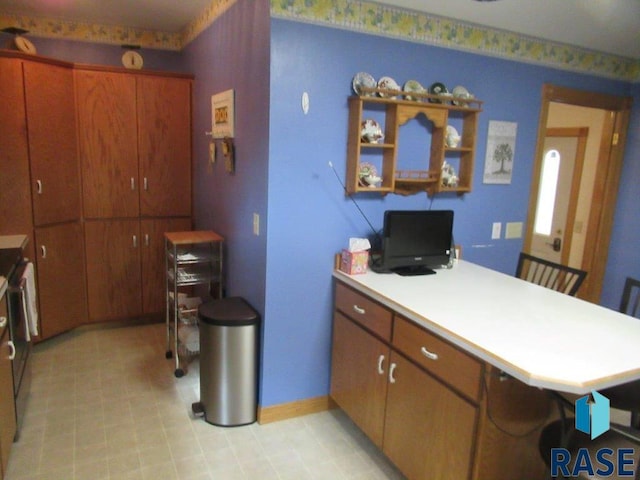 kitchen with a kitchen breakfast bar and kitchen peninsula